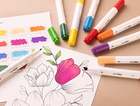 Paper with motif partially colored and markers around