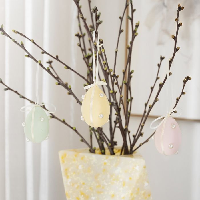 Pastel eggs with half beads and satin ribbon