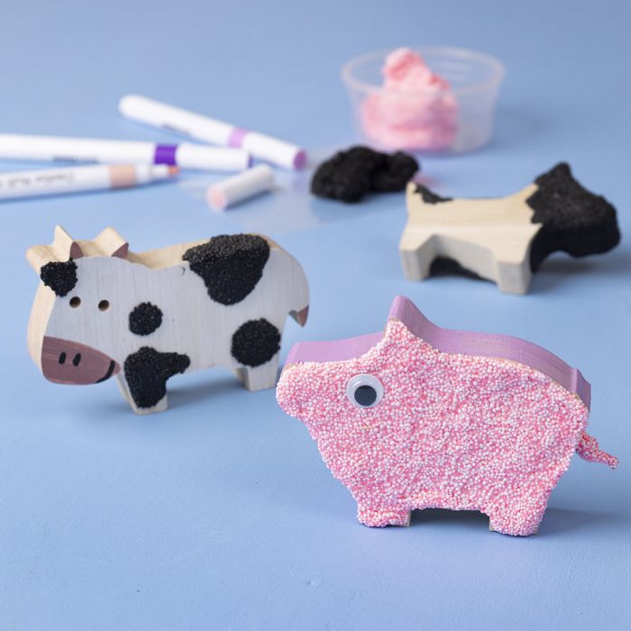 Wooden animals decorated with Foam Clay® and markers