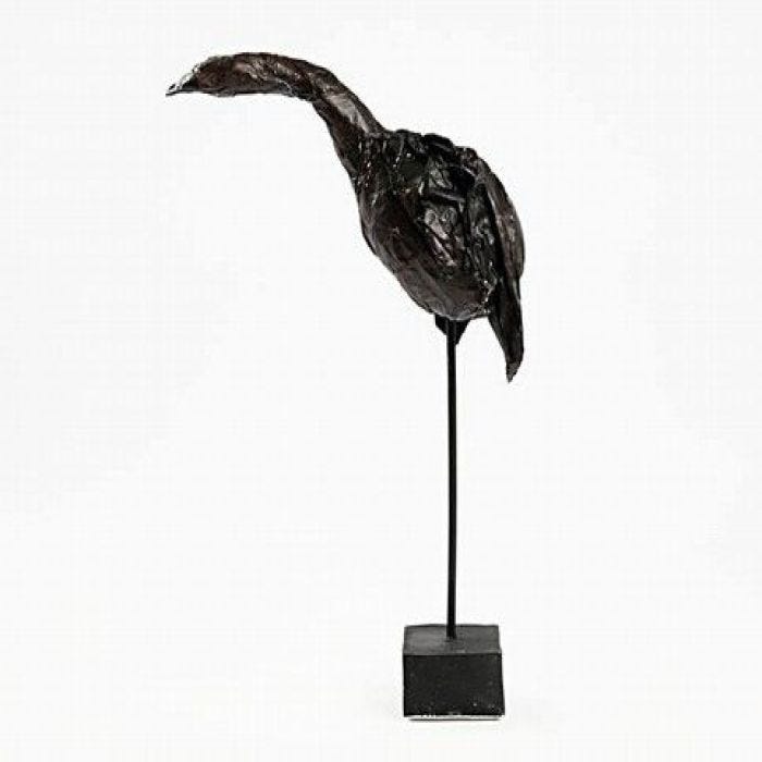 Sculptured bird on a stick