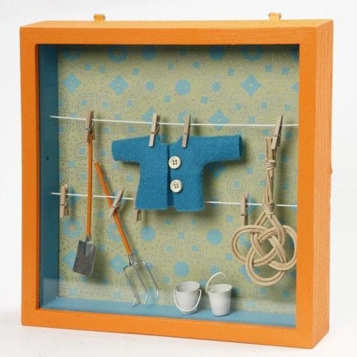 A Framed Box with Clothes Lines