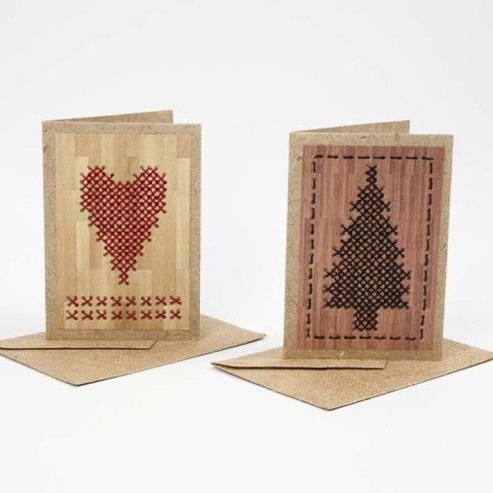 A Greeting Card from Natural Paper with Cross Stitches