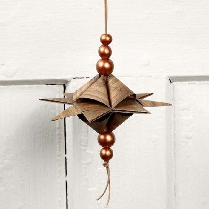 A Pyramid-Shaped Star on a Leather Cord with Beads