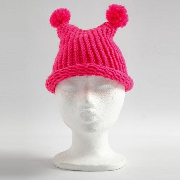 A Hat with two Pom-Poms made on a Knitting Loom