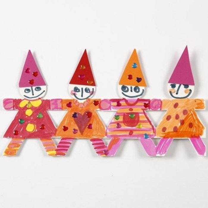 A Christmas Border of Dancing Children made from Punched-Out Card