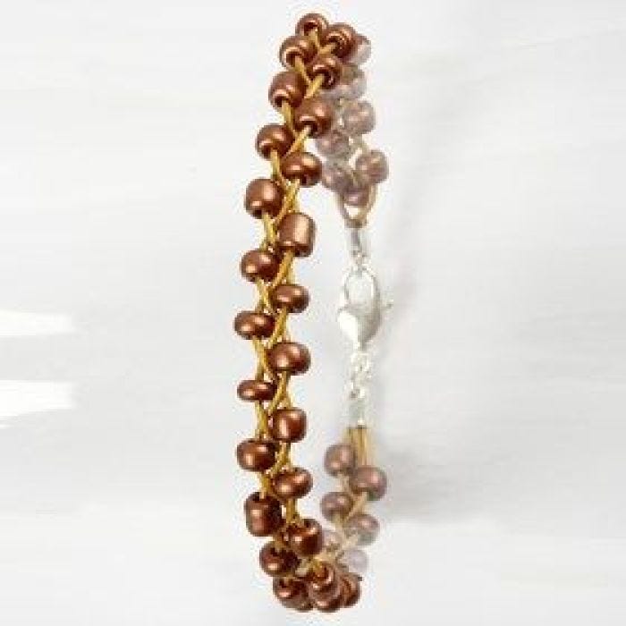 A plaited Bracelet made from Leather Cords & Rocaille Seed Beads