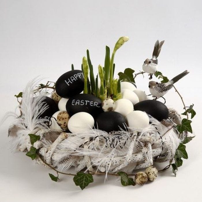 A Wreath made from Branches with Feathers & Goose Eggs with Text