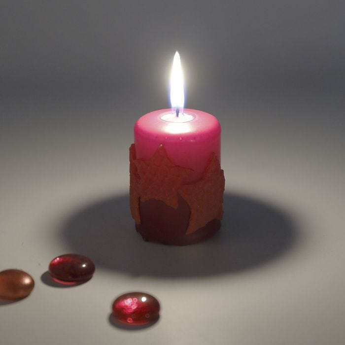 A Pillar Candle with Beeswax Stars