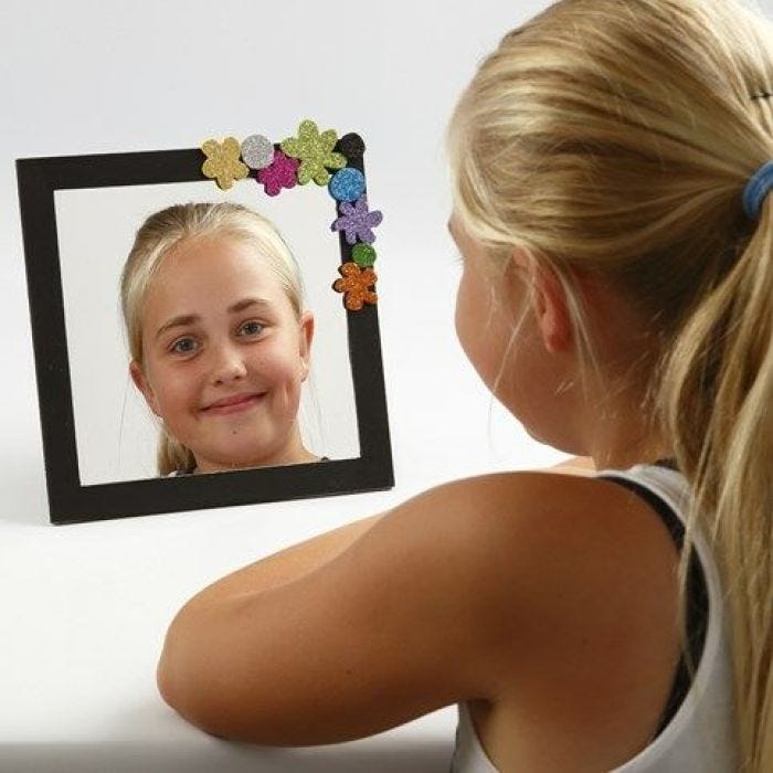 A Mirror in a painted Frame decorated with Foam Rubber