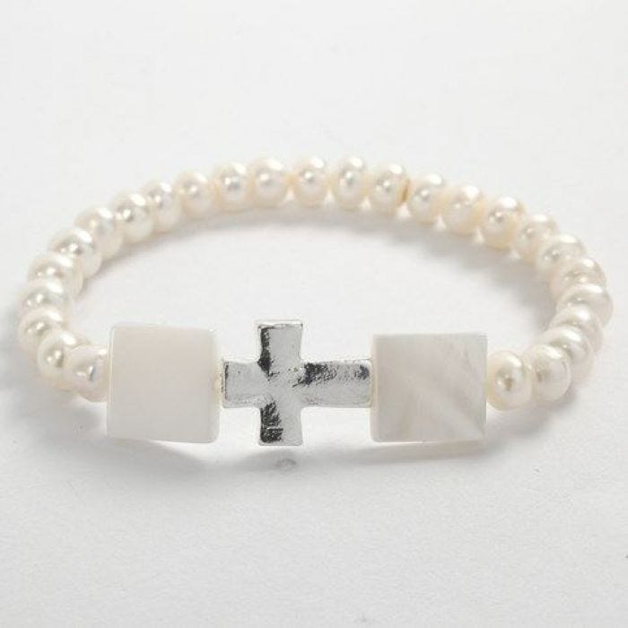 An Elastic Bracelet with white Beads and a Cross