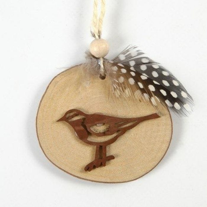 A Bird on a wooden Disc with decorated Flax Twine for hanging