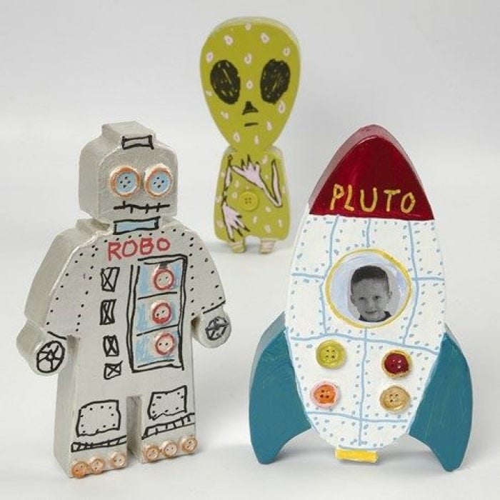 A painted and decorated Papier-Mâché Space Rocket and Aliens