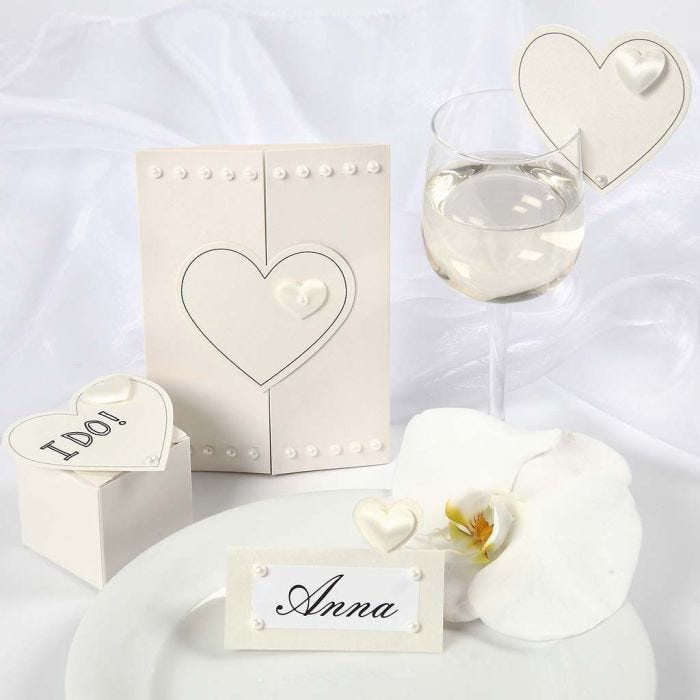 Satin Hearts on a Wedding Invitation and Wedding Decorations