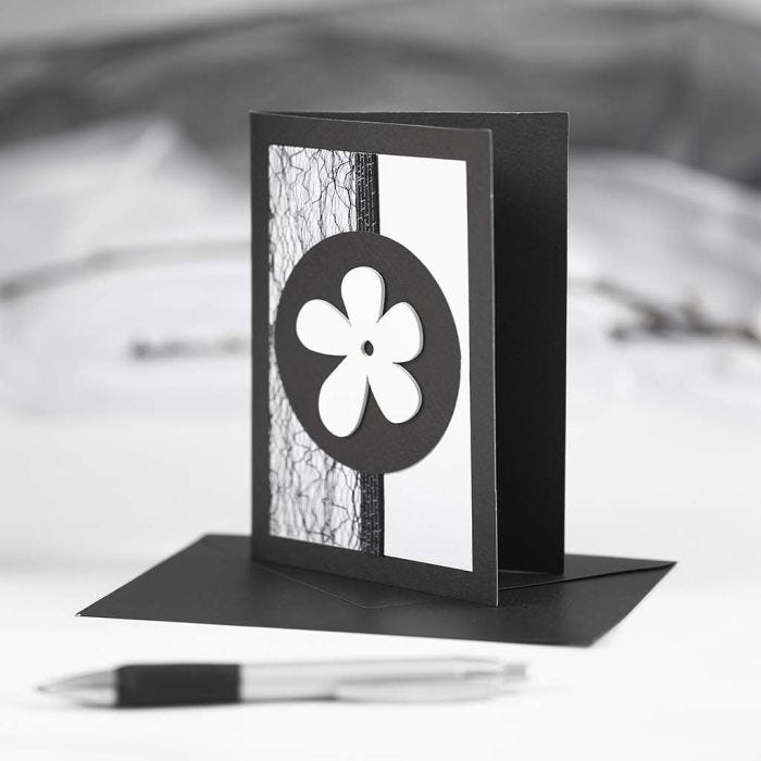 A black Greeting Card with black and white Decorations