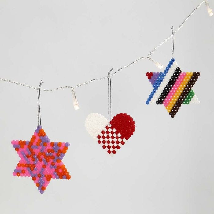 A Heart and Stars made from Nabbi Beads on Peg Boards