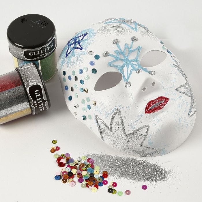 A Face Mask with Glitter on Designs made with transparent Glue