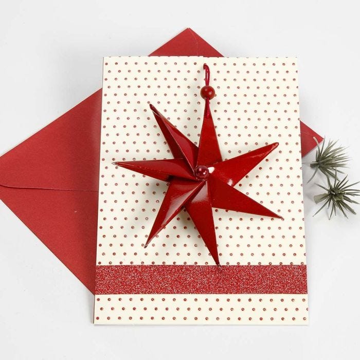 A Christmas Card with a  Seven-Pointed Star in a Piece of Cotton Cord