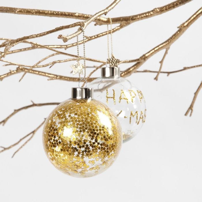 A Glass Bauble with small gold Stars inside