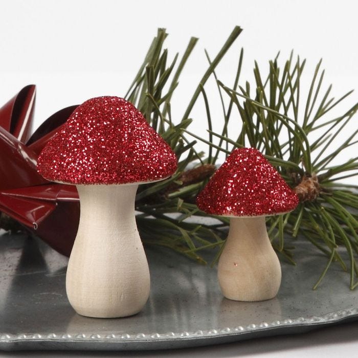 A wooden Toadstool decorated with Glitter