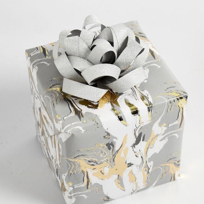 Gift wrapping decorated with a Rosette made from Paper Star Strips