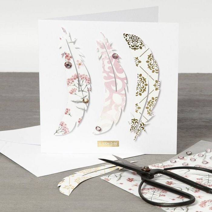 A Greeting Card with Design Paper Feathers on the Front