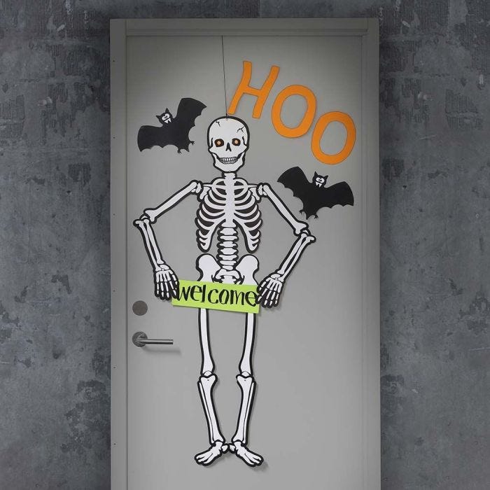 A Halloween Door decorated with a large Skeleton and Bats