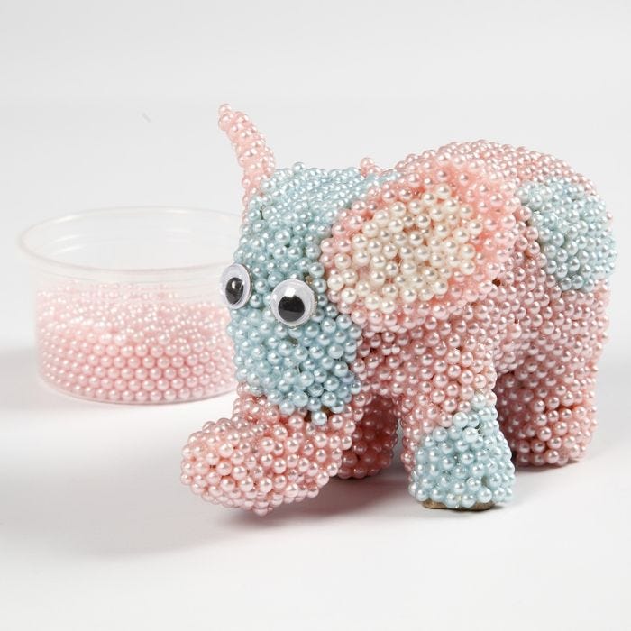 A Papier-mâché Elephant covered with Pearl Clay and Googly Eyes