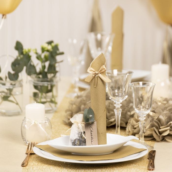 Gold Table Decorations with Paper Flowers, Balloons, a Napkin folded like a Tower and Place Cards