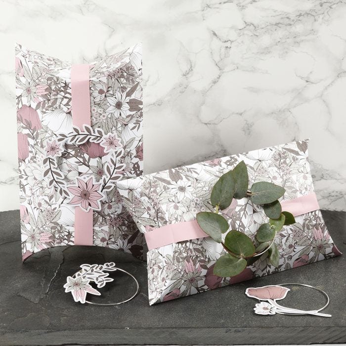 Pillow Boxes decorated with pink Ribbon, a Metal Ring and Card Flower Cut-Outs