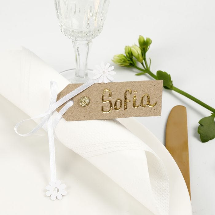 A Place Card from a Manilla Tag decorated with Deco Foil, Rhinestones and Satin Ribbon