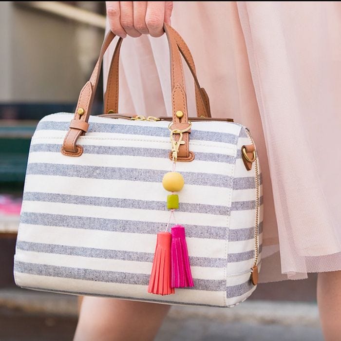 A handbag pendant with tassels and beads made from Fimo modelling clay 