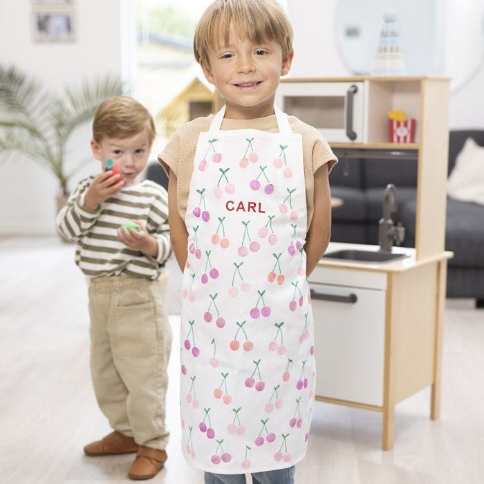 An apron with name and stamped fruit designs