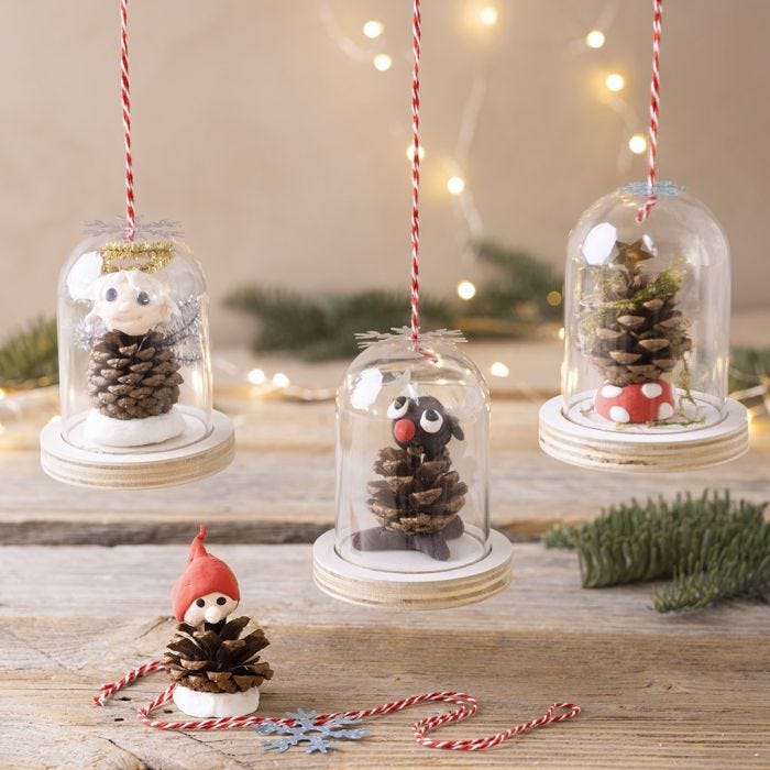 Festive bells with pine cone decorations for hanging