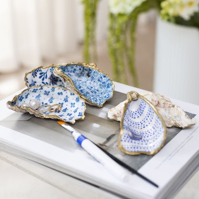 Oyster shells decorated with decoupage and gold marker
