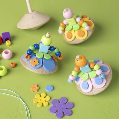 Spinning tops decorated as little ballerinas