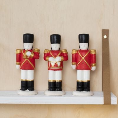 A Terracotta Nutcracker decorated with Plus Color