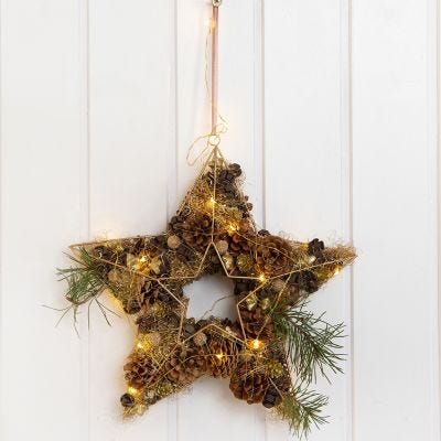 A Metal Star for a Door Decoration decorated with Cones