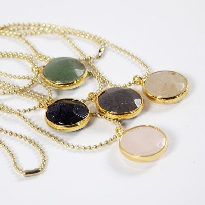 A Bead Chain Necklace and Jewellery Pendant with a Stone
