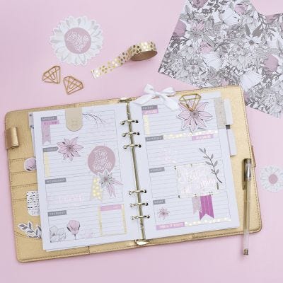 A decorated 5-week Planner for a Bullet Journal and a Calendar