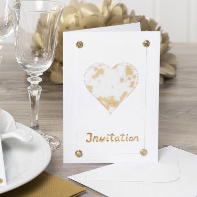 An Invitation decorated with a Vellum Paper Heart