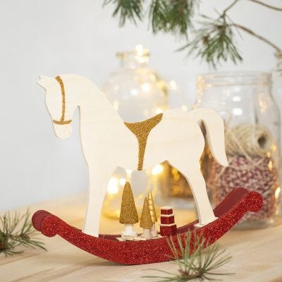 A Rocking Horse with small wooden Accessories deocrated with Craft Paint