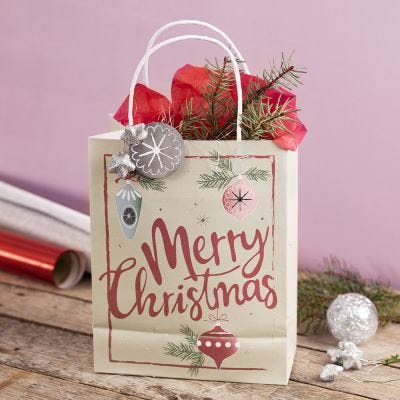 A gift bag with a Christmas design