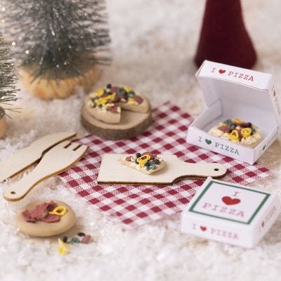 Elf is having a pizza picnic