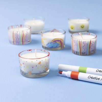 Candle cast in a tealight holder and decorated with markers