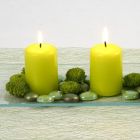 Lime-coloured Pillar Candles and Glass Deco Stones on a Glass Dish