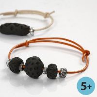 A Bracelet made from Clay Beads, blackened on a Bonfire