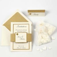An off-white and gold Invitation and Place Card