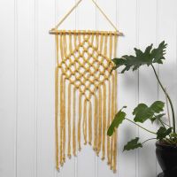 A braided Wall Hanging with Macramé from Cotton Tube Yarn