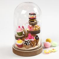 A Dome Bell Jar with Miniature Cupcakes