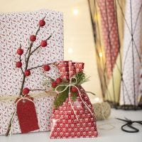Christmas Gift Wrapping with a Twig and artificial Berries